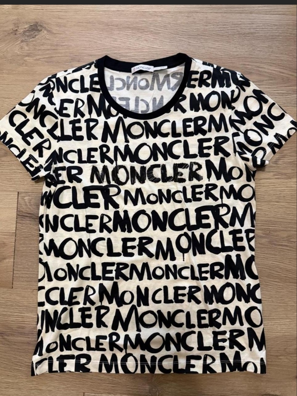 THE MONCLER THAT ENTERED THE ROOM FIRST